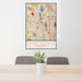 24x36 Robbinsdale Minnesota Map Print Portrait Orientation in Woodblock Style Behind 2 Chairs Table and Potted Plant