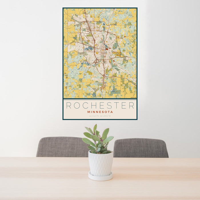 24x36 Rochester Minnesota Map Print Portrait Orientation in Woodblock Style Behind 2 Chairs Table and Potted Plant