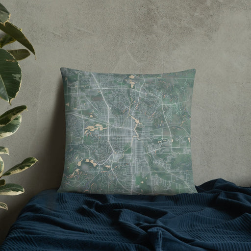 Custom Rochester Minnesota Map Throw Pillow in Afternoon on Bedding Against Wall