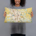 Person holding 20x12 Custom Rochester Minnesota Map Throw Pillow in Woodblock