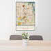 24x36 Rochester New York Map Print Portrait Orientation in Woodblock Style Behind 2 Chairs Table and Potted Plant