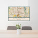 24x36 Rochester New York Map Print Landscape Orientation in Woodblock Style Behind 2 Chairs Table and Potted Plant