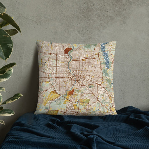 Custom Rochester New York Map Throw Pillow in Woodblock on Bedding Against Wall