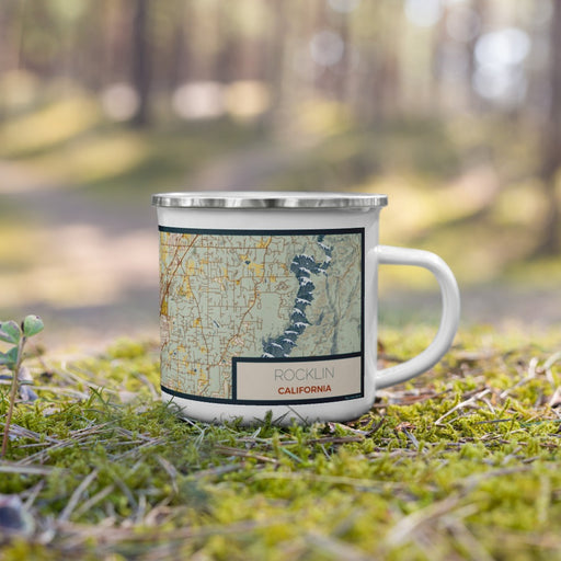 Right View Custom Rocklin California Map Enamel Mug in Woodblock on Grass With Trees in Background