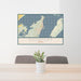 24x36 Rockport Texas Map Print Lanscape Orientation in Woodblock Style Behind 2 Chairs Table and Potted Plant