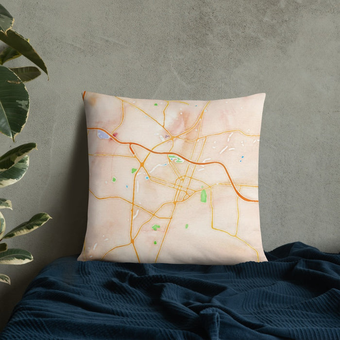Custom Rocky Mount North Carolina Map Throw Pillow in Watercolor on Bedding Against Wall