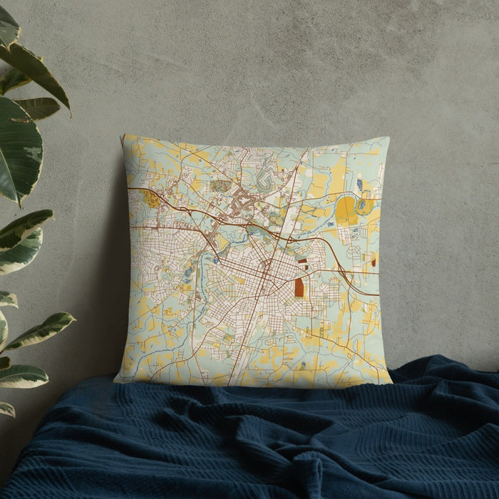 Custom Rocky Mount North Carolina Map Throw Pillow in Woodblock on Bedding Against Wall