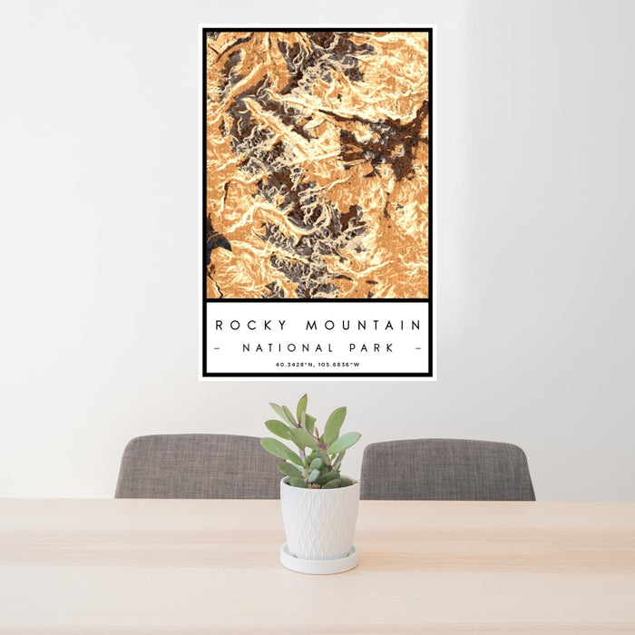 24x36 Rocky Mountain National Park Map Print Portrait Orientation in Ember Style Behind 2 Chairs Table and Potted Plant