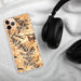 Custom Rocky Mountain National Park Map Phone Case in Ember on Table with Black Headphones