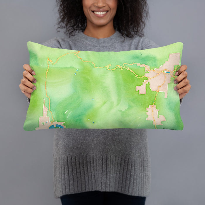 Person holding 20x12 Custom Rocky Mountain National Park Map Throw Pillow in Watercolor