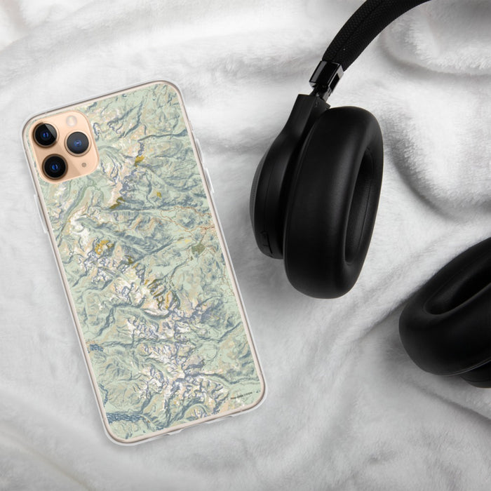 Custom Rocky Mountain National Park Map Phone Case in Woodblock on Table with Black Headphones