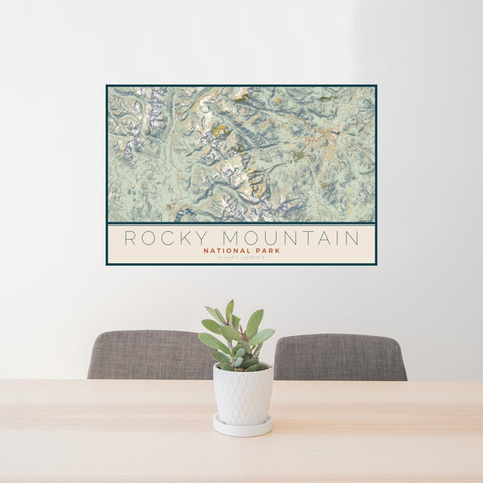 24x36 Rocky Mountain National Park Map Print Landscape Orientation in Woodblock Style Behind 2 Chairs Table and Potted Plant