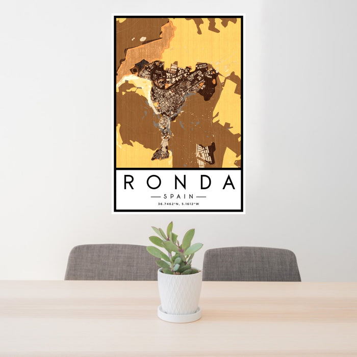 24x36 Ronda Spain Map Print Portrait Orientation in Ember Style Behind 2 Chairs Table and Potted Plant
