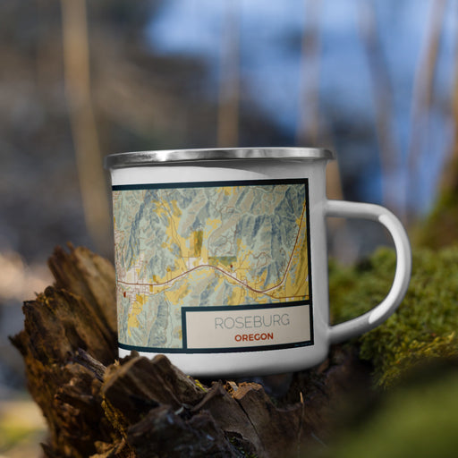 Right View Custom Roseburg Oregon Map Enamel Mug in Woodblock on Grass With Trees in Background