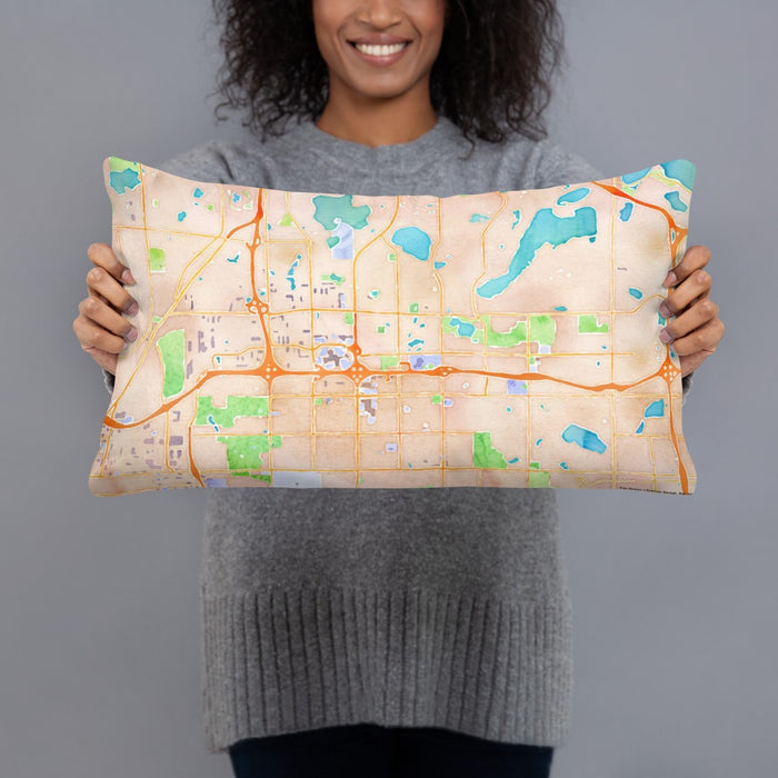 Person holding 20x12 Custom Roseville Minnesota Map Throw Pillow in Watercolor