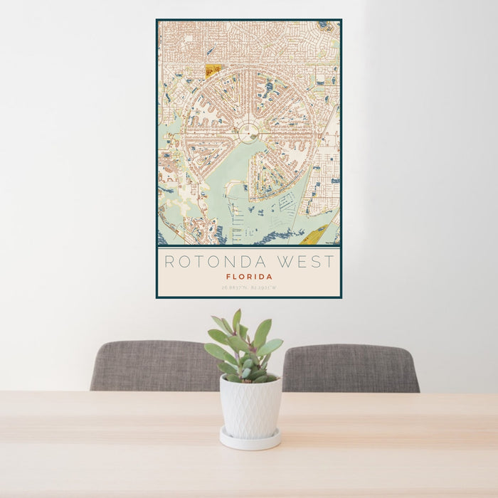 24x36 Rotonda West Florida Map Print Portrait Orientation in Woodblock Style Behind 2 Chairs Table and Potted Plant