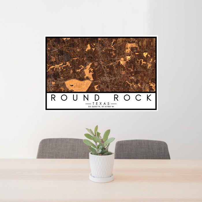 24x36 Round Rock Texas Map Print Lanscape Orientation in Ember Style Behind 2 Chairs Table and Potted Plant