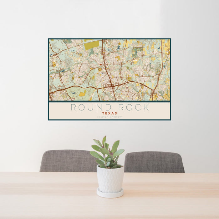 24x36 Round Rock Texas Map Print Lanscape Orientation in Woodblock Style Behind 2 Chairs Table and Potted Plant