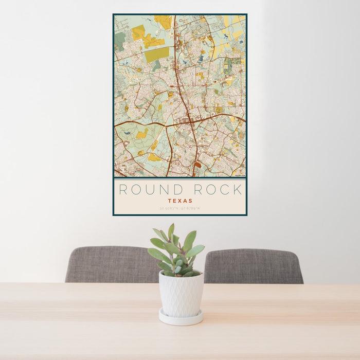 24x36 Round Rock Texas Map Print Portrait Orientation in Woodblock Style Behind 2 Chairs Table and Potted Plant