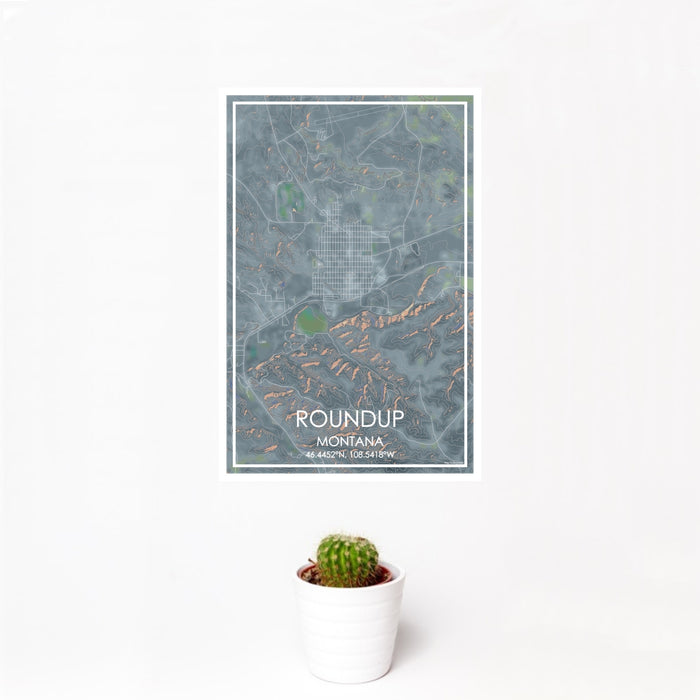 12x18 Roundup Montana Map Print Portrait Orientation in Afternoon Style With Small Cactus Plant in White Planter