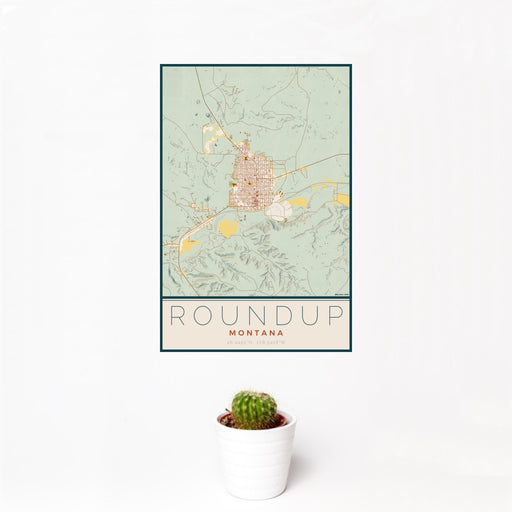 12x18 Roundup Montana Map Print Portrait Orientation in Woodblock Style With Small Cactus Plant in White Planter