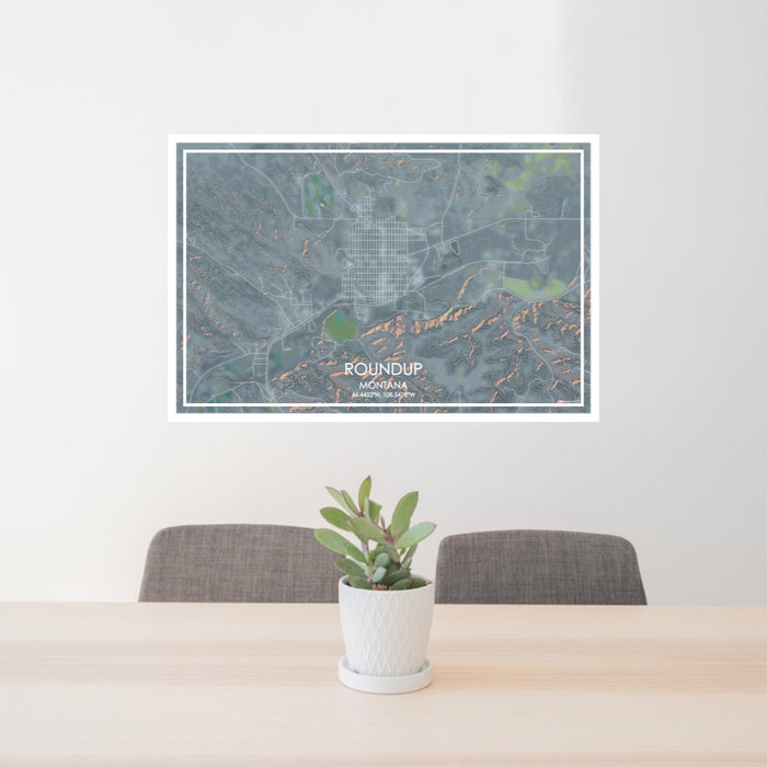 24x36 Roundup Montana Map Print Lanscape Orientation in Afternoon Style Behind 2 Chairs Table and Potted Plant