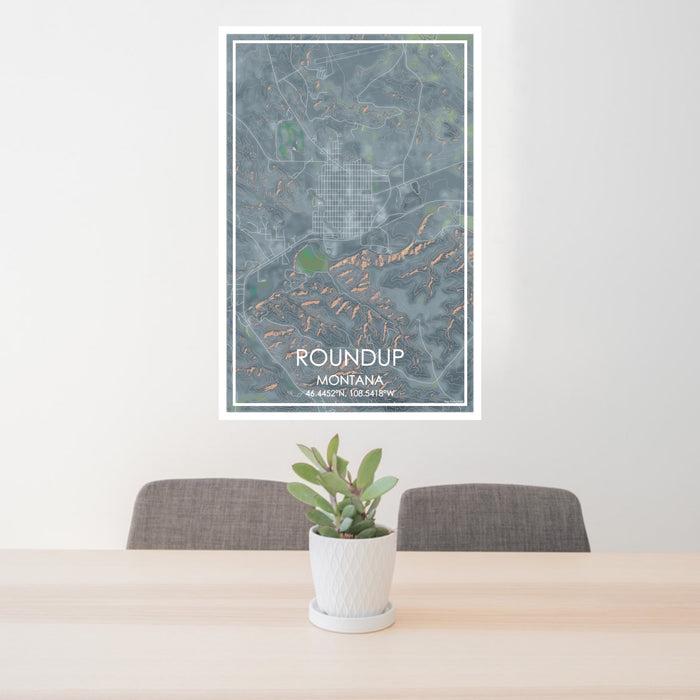 24x36 Roundup Montana Map Print Portrait Orientation in Afternoon Style Behind 2 Chairs Table and Potted Plant