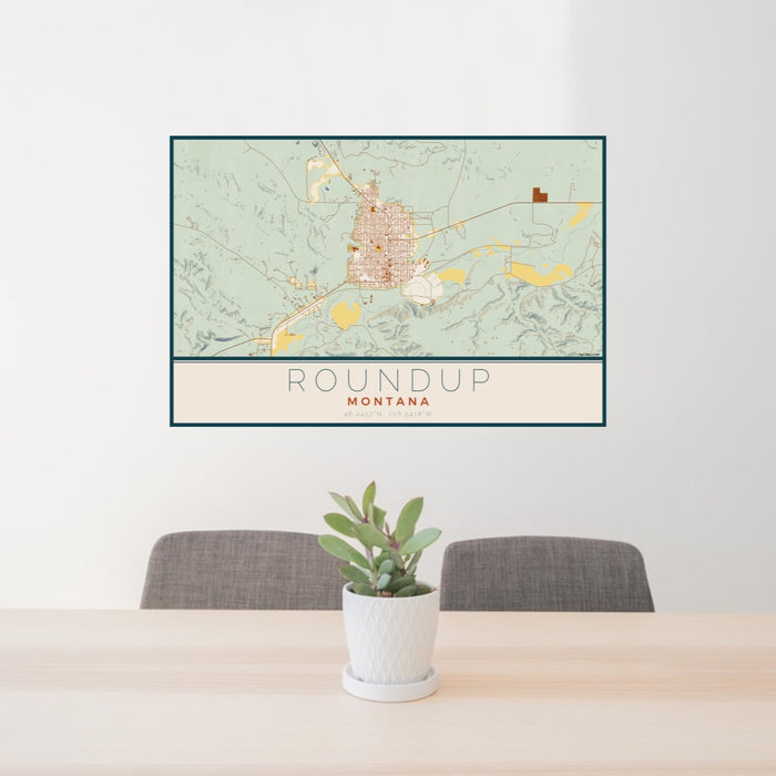 24x36 Roundup Montana Map Print Lanscape Orientation in Woodblock Style Behind 2 Chairs Table and Potted Plant