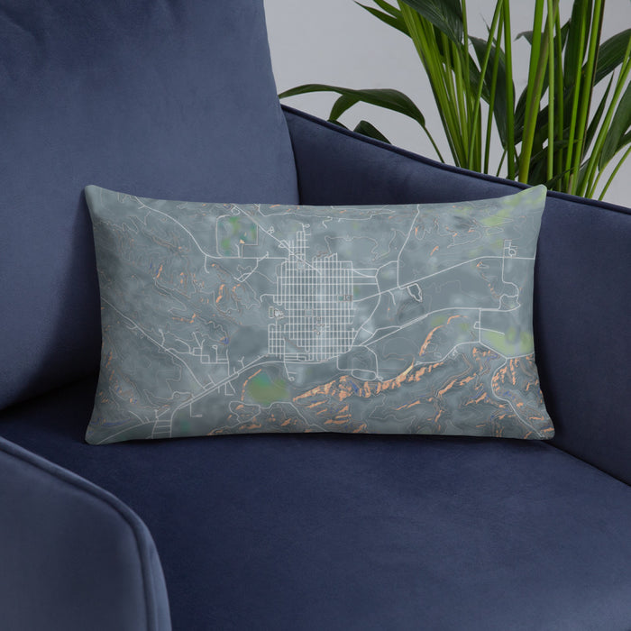 Custom Roundup Montana Map Throw Pillow in Afternoon on Blue Colored Chair