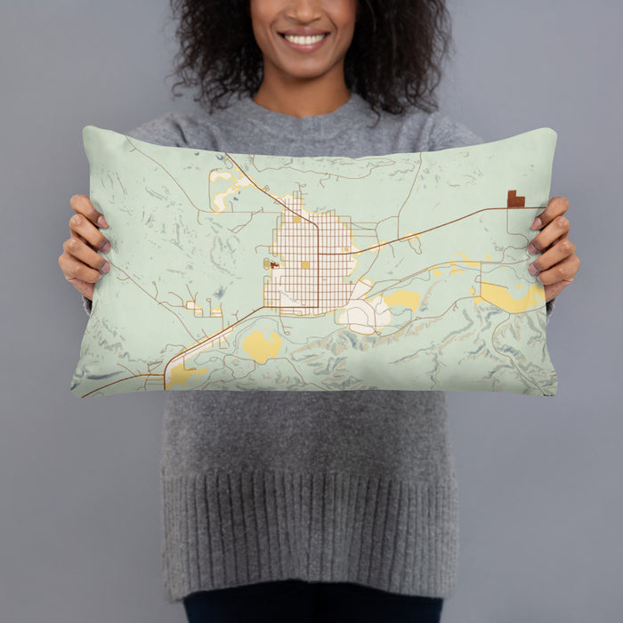 Person holding 20x12 Custom Roundup Montana Map Throw Pillow in Woodblock