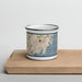 Front View Custom Rye New York Map Enamel Mug in Woodblock on Cutting Board