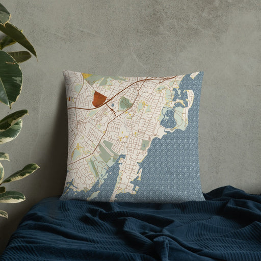 Custom Rye New York Map Throw Pillow in Woodblock on Bedding Against Wall