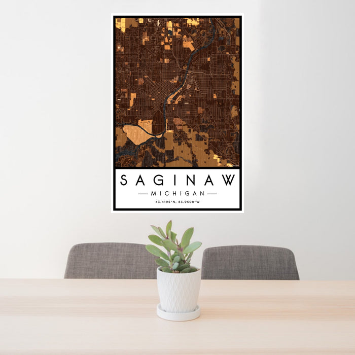 24x36 Saginaw Michigan Map Print Portrait Orientation in Ember Style Behind 2 Chairs Table and Potted Plant