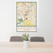 24x36 Saginaw Michigan Map Print Portrait Orientation in Woodblock Style Behind 2 Chairs Table and Potted Plant
