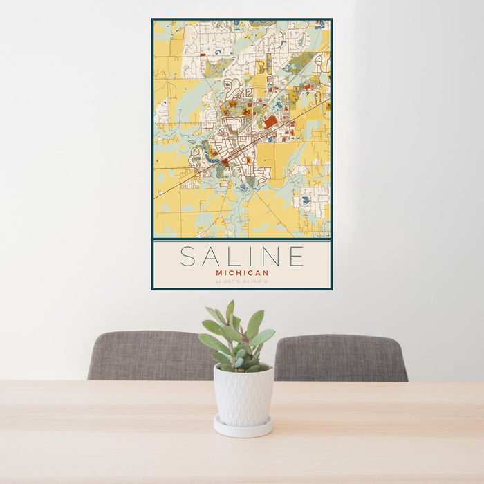 24x36 Saline Michigan Map Print Portrait Orientation in Woodblock Style Behind 2 Chairs Table and Potted Plant