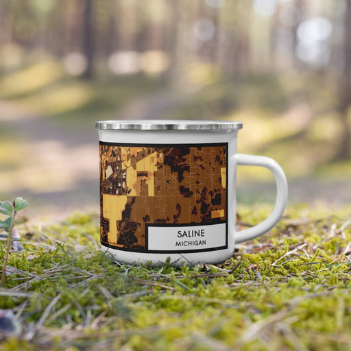 Right View Custom Saline Michigan Map Enamel Mug in Ember on Grass With Trees in Background