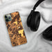 Custom Saline Michigan Map Phone Case in Ember on Table with Black Headphones