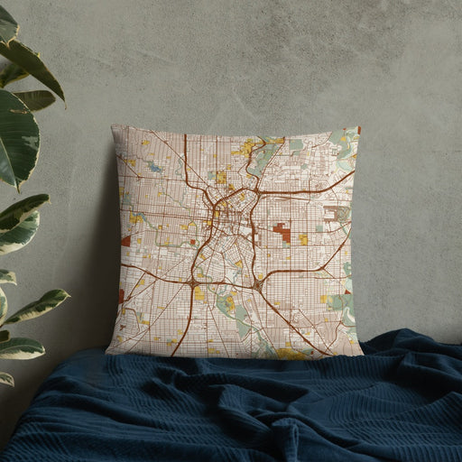 Custom San Antonio Texas Map Throw Pillow in Woodblock on Bedding Against Wall