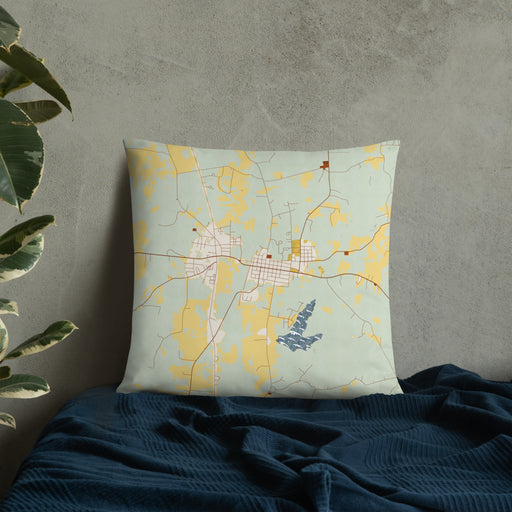 Custom San Augustine Texas Map Throw Pillow in Woodblock on Bedding Against Wall