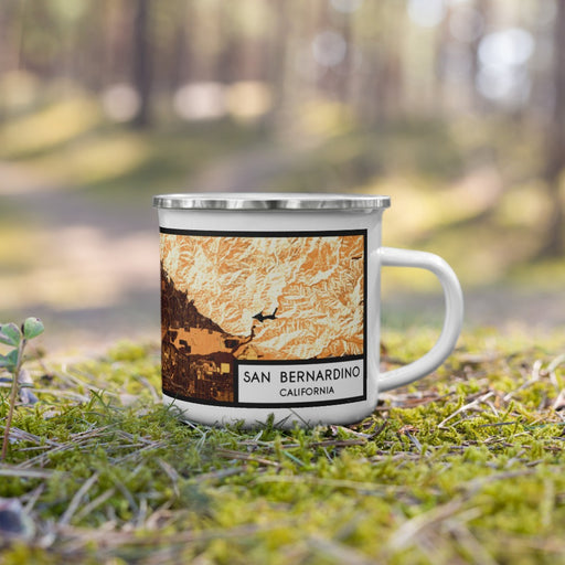 Right View Custom San Bernardino California Map Enamel Mug in Ember on Grass With Trees in Background