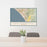 24x36 San Clemente California Map Print Landscape Orientation in Woodblock Style Behind 2 Chairs Table and Potted Plant