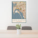 24x36 San Diego California Map Print Portrait Orientation in Woodblock Style Behind 2 Chairs Table and Potted Plant