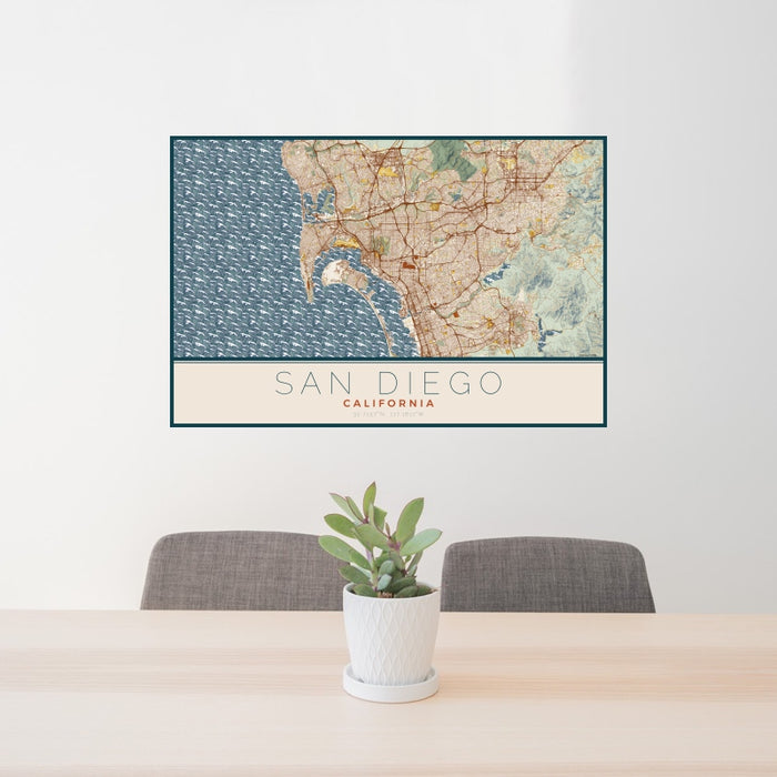 24x36 San Diego California Map Print Landscape Orientation in Woodblock Style Behind 2 Chairs Table and Potted Plant