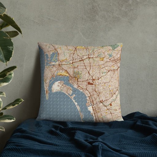 Custom San Diego California Map Throw Pillow in Woodblock on Bedding Against Wall