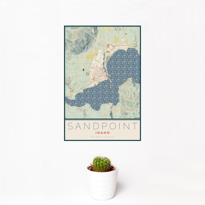 12x18 Sandpoint Idaho Map Print Portrait Orientation in Woodblock Style With Small Cactus Plant in White Planter