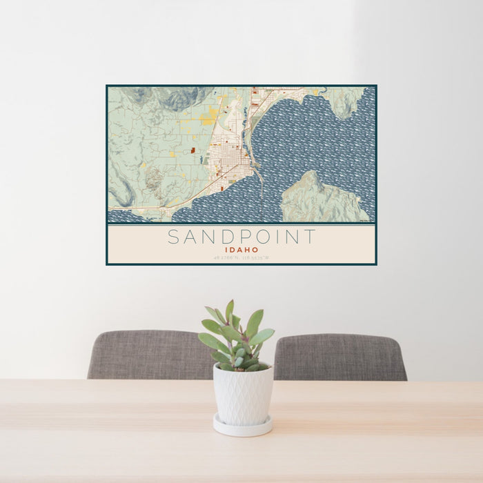 24x36 Sandpoint Idaho Map Print Lanscape Orientation in Woodblock Style Behind 2 Chairs Table and Potted Plant