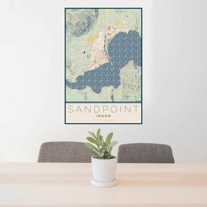 24x36 Sandpoint Idaho Map Print Portrait Orientation in Woodblock Style Behind 2 Chairs Table and Potted Plant