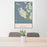 24x36 San Juan Island Washington Map Print Portrait Orientation in Woodblock Style Behind 2 Chairs Table and Potted Plant