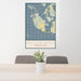 24x36 San Juan Island Washington Map Print Portrait Orientation in Woodblock Style Behind 2 Chairs Table and Potted Plant