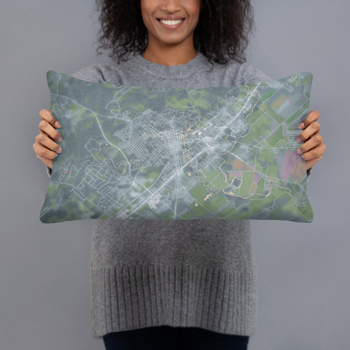Person holding 20x12 Custom San Marcos Texas Map Throw Pillow in Afternoon